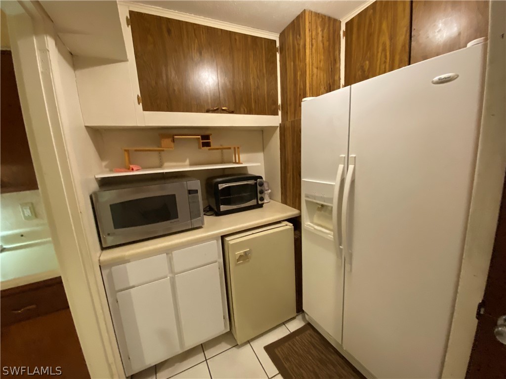 119 Apache Street Lehigh Acres, FL 33936 - Photo 15 of 29 a utility room with dryer and washer
