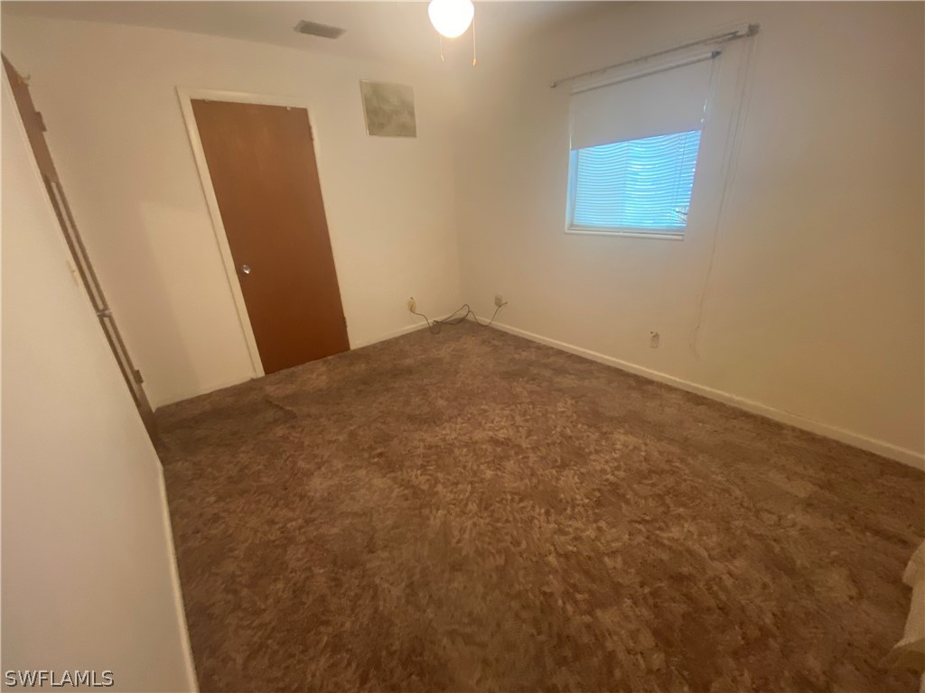119 Apache Street Lehigh Acres, FL 33936 - Photo 22 of 29 a view of a room with window