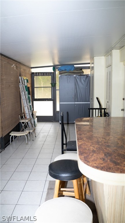 119 Apache Street Lehigh Acres, FL 33936 - Photo 27 of 29 a room with gym equipment and a rug