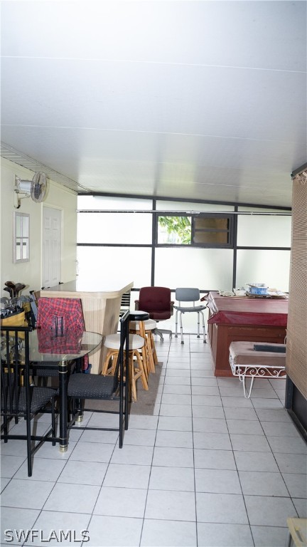 119 Apache Street Lehigh Acres, FL 33936 - Photo 29 of 29 a kitchen with a table chairs and a window