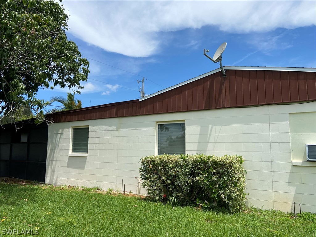 119 Apache Street Lehigh Acres, FL 33936 - Photo 4 of 29 a front view of house with yard