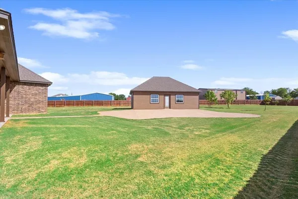 a view of a house with a big yard