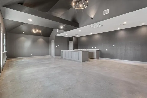 an empty room with wooden floor