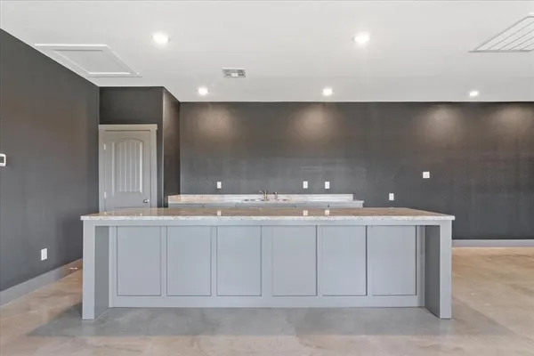 an empty room with a sink