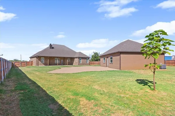 a view of a house with pool yard and a yard