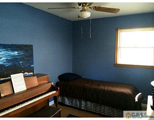 8 Winant Road Kendall Park, NJ 08824 - Photo 14 of 23 a bedroom with a bed and a window