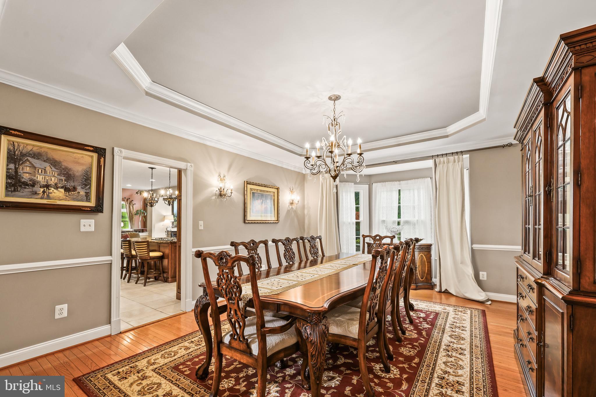 40890 Beechnut Road Leesburg, VA 20175 - Photo 11 of 65 a view of a dining room with furniture and chandelier