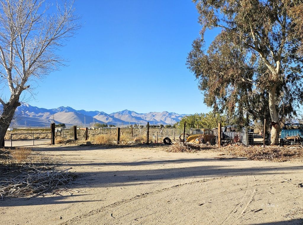 1330 North Pluto Street Ridgecrest, CA 93555 - Photo 25 of 32 a view of large house with a road
