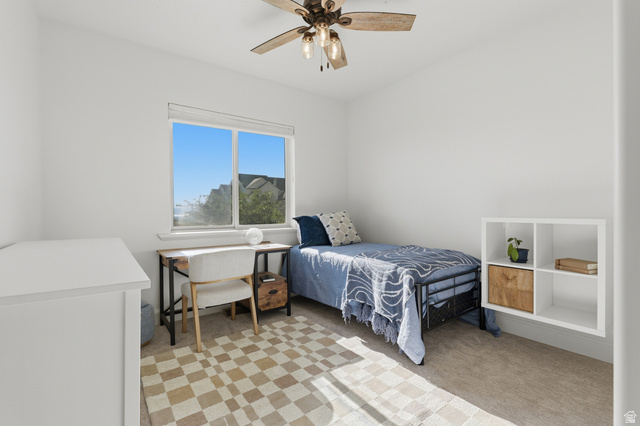441 South 2080th Street East Springville, UT 84663 - Photo 22 of 64 Room featuring a light-toned carpet, a window with a white frame, and a ceiling fan with integrated lighting