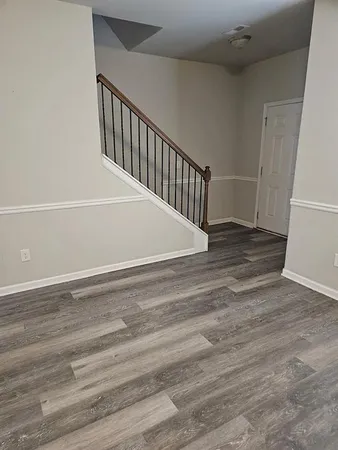 a view of entryway with wooden floor