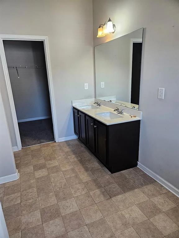 7373 Ledgestone Lane Riverdale, GA 30274 - Photo 9 of 13 a bathroom with a sink vanity and mirror