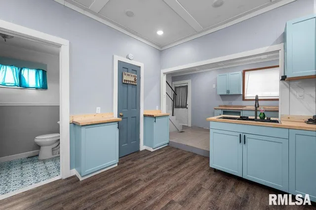 a kitchen with a sink and a stove