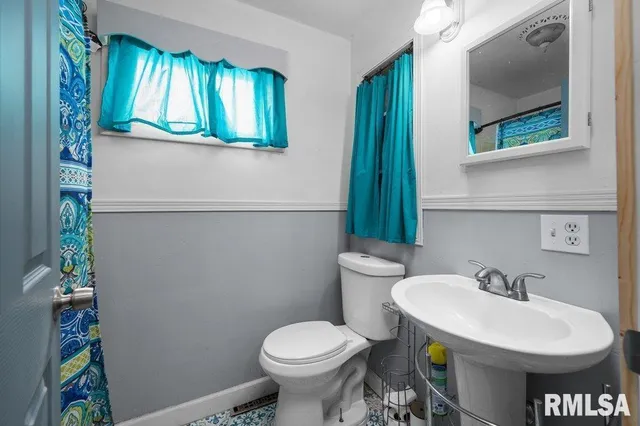 a bathroom with a sink and a toilet