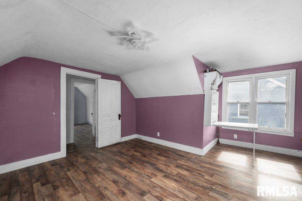 210 North 5th Street Clinton, IA 52732 - Photo 20 of 35 a view of empty room with wooden floor and fan