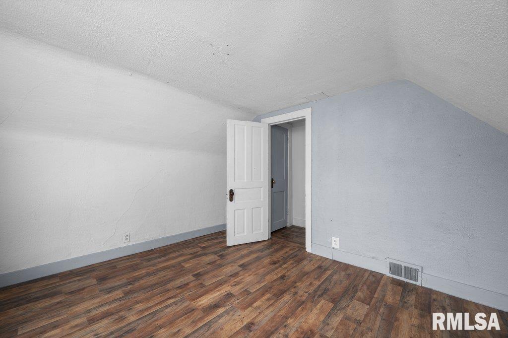 210 North 5th Street Clinton, IA 52732 - Photo 22 of 35 a view of an empty room and wooden floor