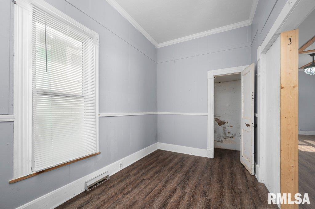 210 North 5th Street Clinton, IA 52732 - Photo 8 of 35 a view of empty room with wooden floor