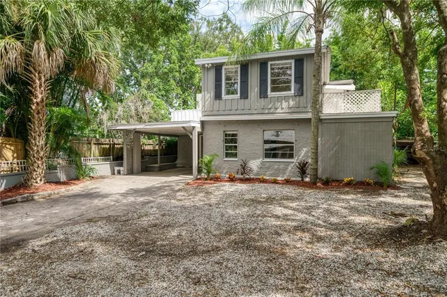 a front view of a house with a yard and a garage