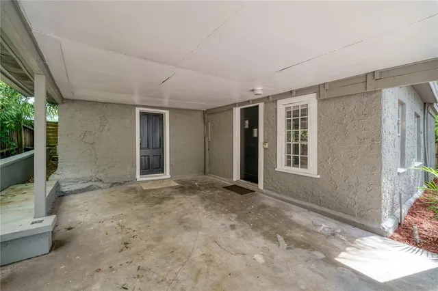 a view of an empty room with a window