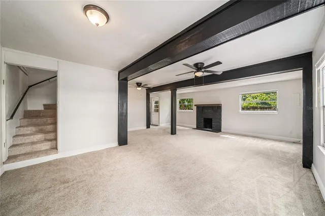 a view of a hallway with a fireplace