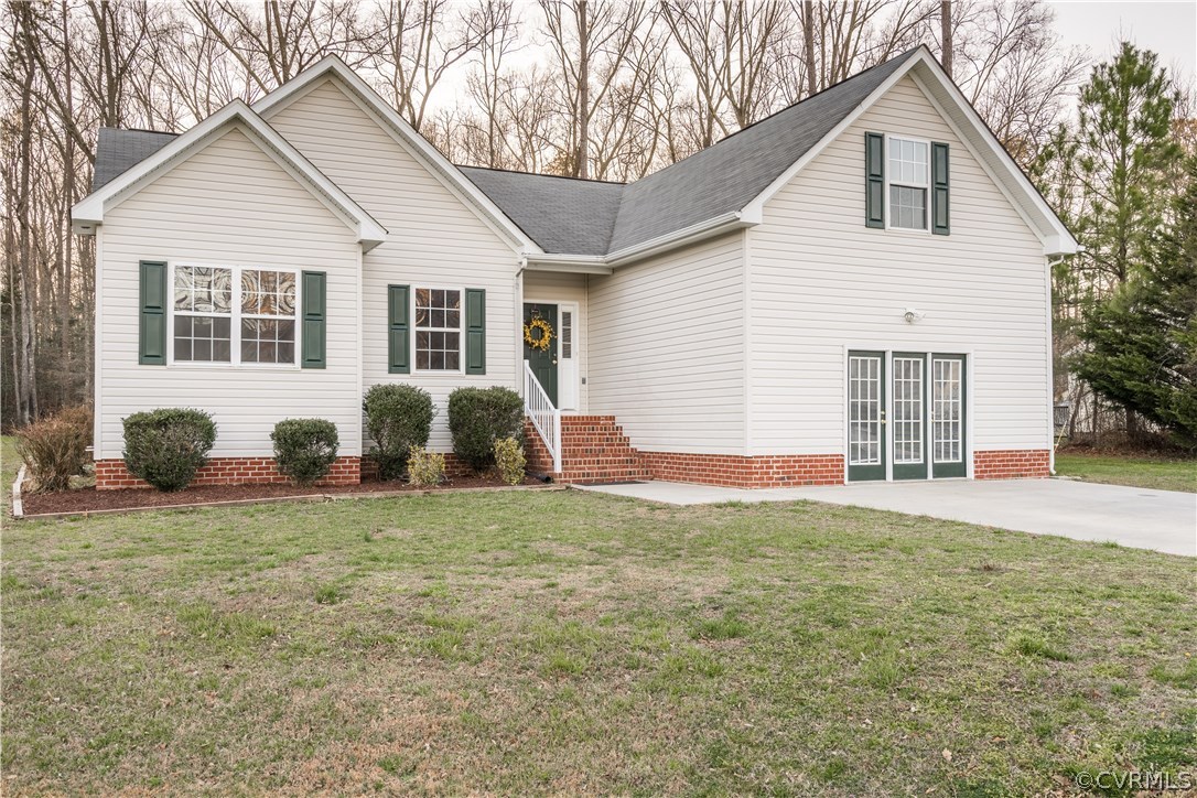 14613 Clover Ridge Lane Chesterfield, VA 23832 - Photo 2 of 36 a view of a yard in front of a house with plants