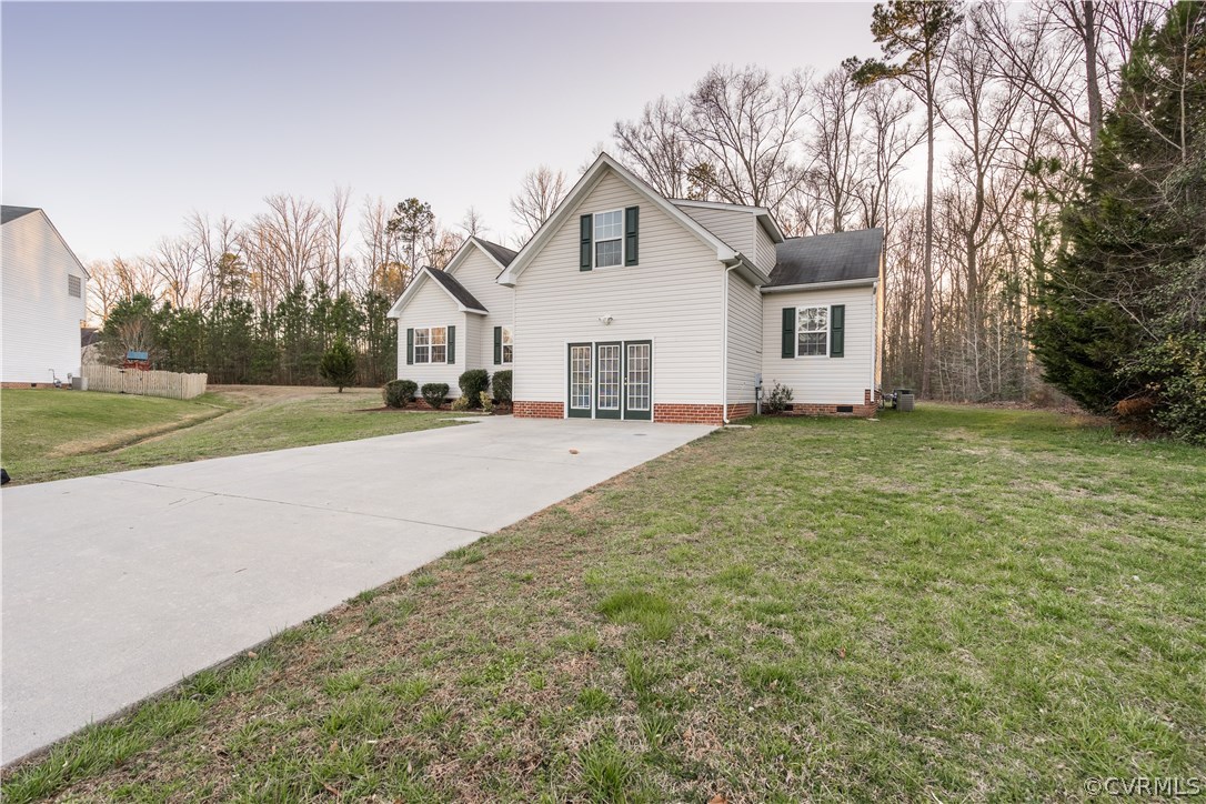 14613 Clover Ridge Lane Chesterfield, VA 23832 - Photo 36 of 36 a view of a house with a yard and garage