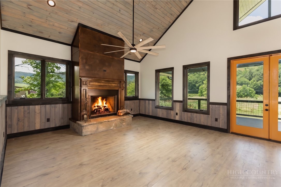 790 Howard Edmisten Road Sugar Grove, NC 28679 - Photo 6 of 45 a view of an empty room with window and fire place
