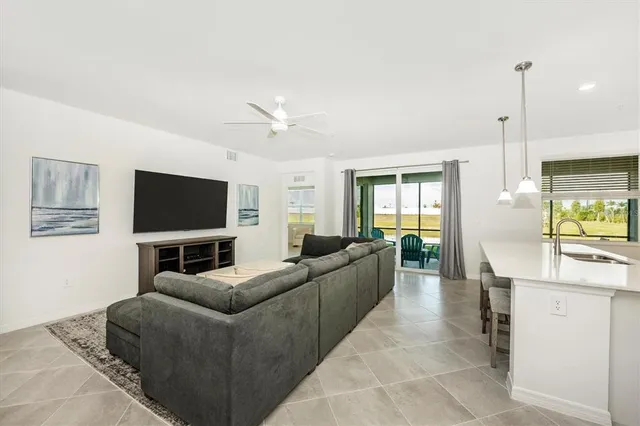 a bedroom with a large bed and a flat screen tv