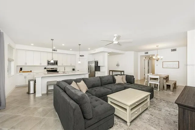 a bathroom with a granite countertop sink a mirror and a shower