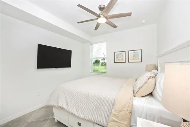 a front view of a house with glass windows and furniture