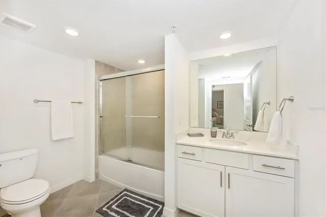 a view of a room with gym equipment and a large window