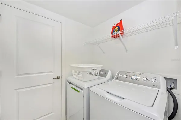 a view of a house with backyard porch and sitting area