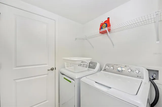 a view of a house with backyard porch and sitting area