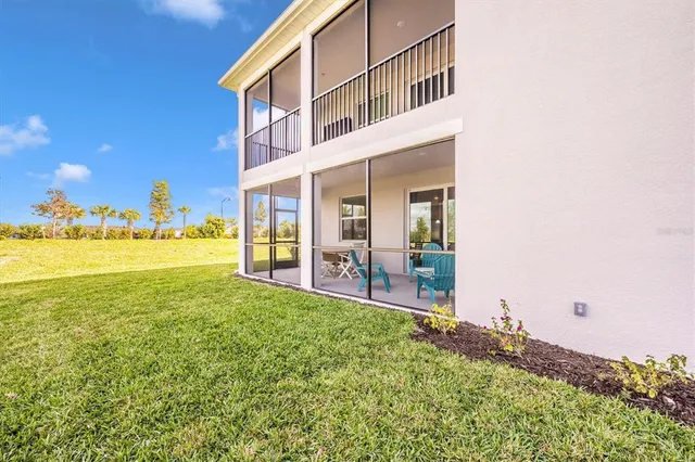 a view of a patio with a table and chairs