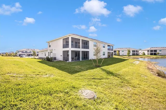 a view of a swimming pool with an ocean and trees