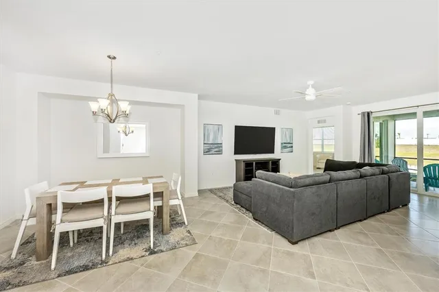 a kitchen with white cabinets stainless steel appliances and sink