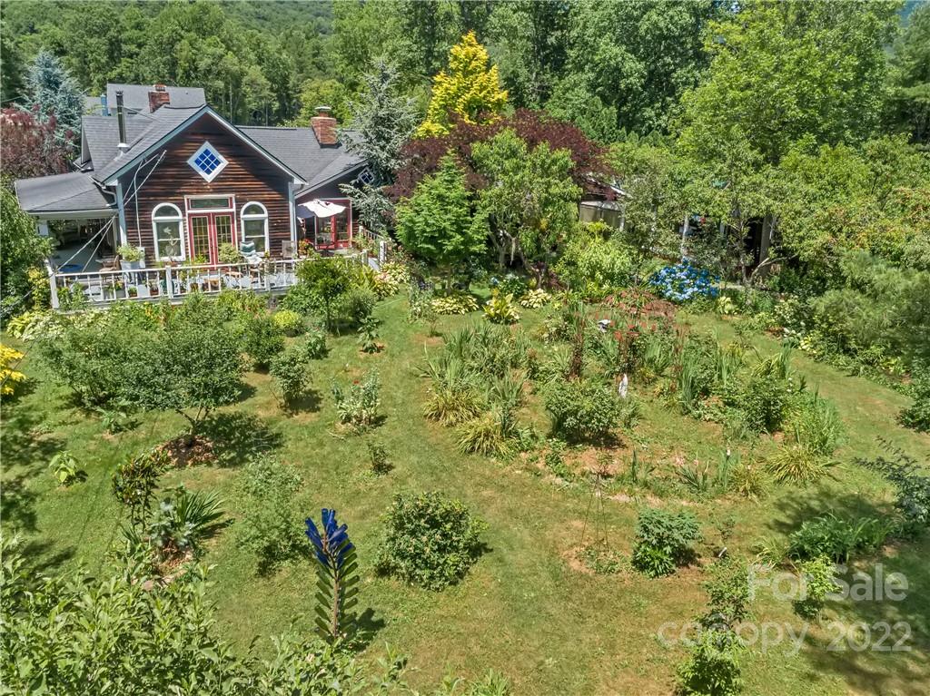 528 Padgettown Road Black Mountain, NC 28711 - Photo 5 of 37 a view of a big house with a big yard and large trees