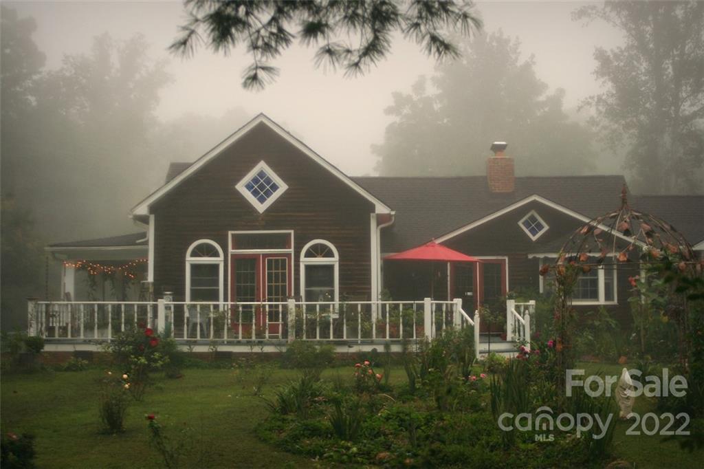 528 Padgettown Road Black Mountain, NC 28711 - Photo 6 of 37 a front view of a house with yard and green space