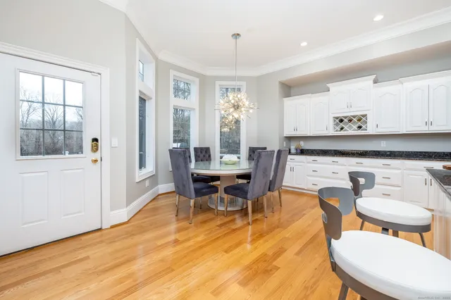 a view of a dining room with furniture and window