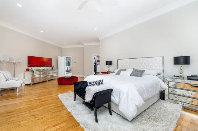 a bedroom with bed and a couch