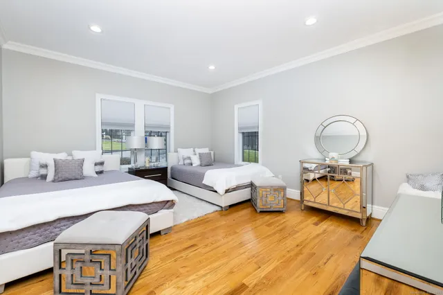 a bedroom with bed and window