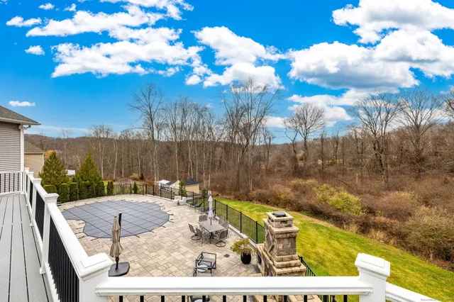 a view of a backyard with sitting area