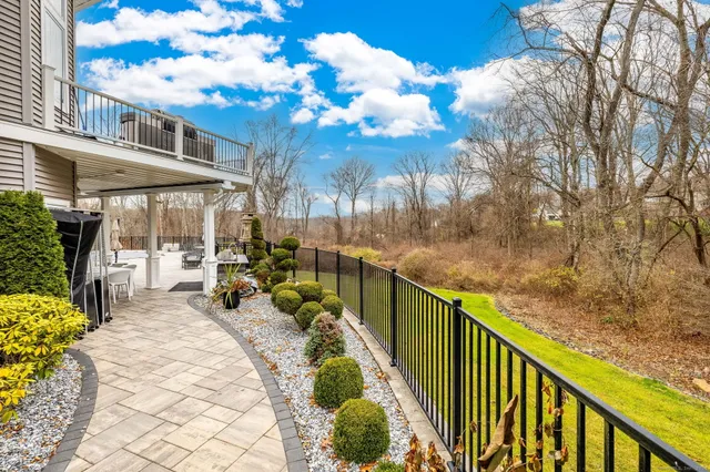 a view of a chairs and table in the balcony