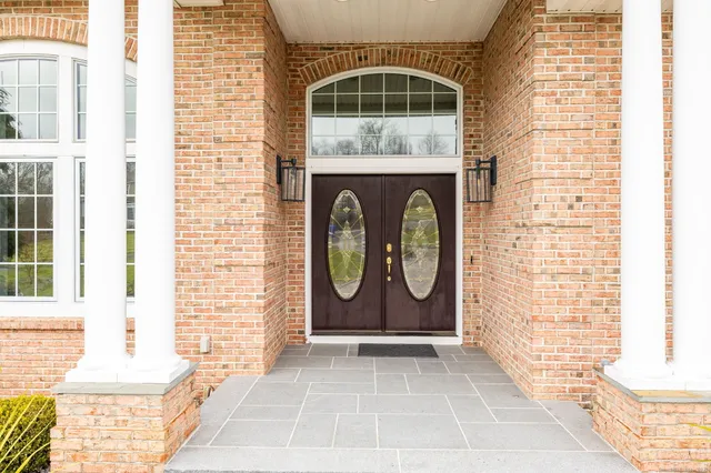 a front view of a house with a gate