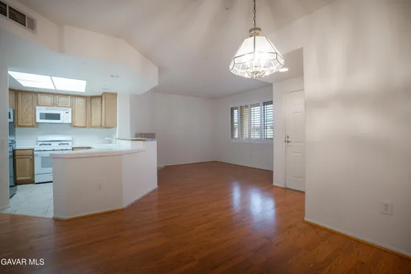 a kitchen with a sink stove and microwave