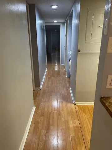 a view of a bedroom from a hallway