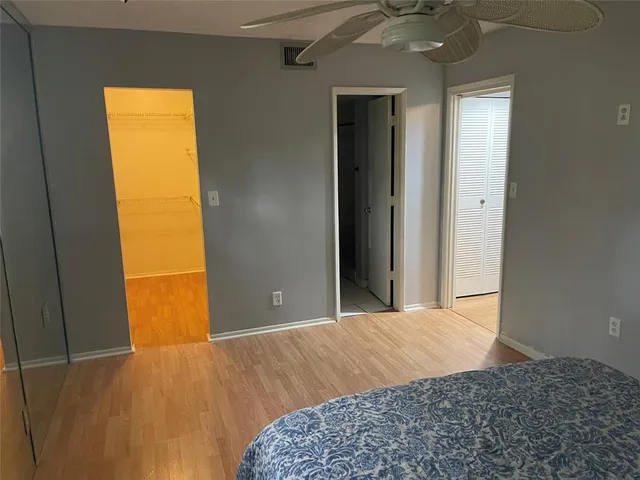 a bathroom with a sink a toilet a mirror and vanity