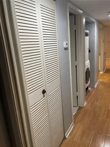 an empty room with a empty space and windows