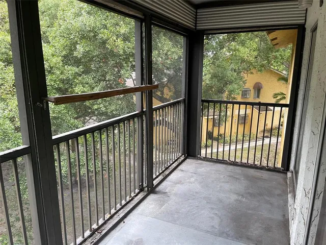 a view of a swimming pool with outdoor seating