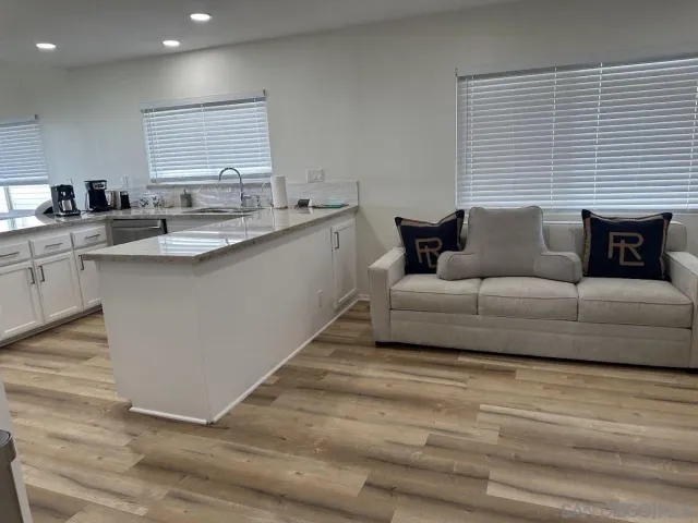 a living room with furniture and a table