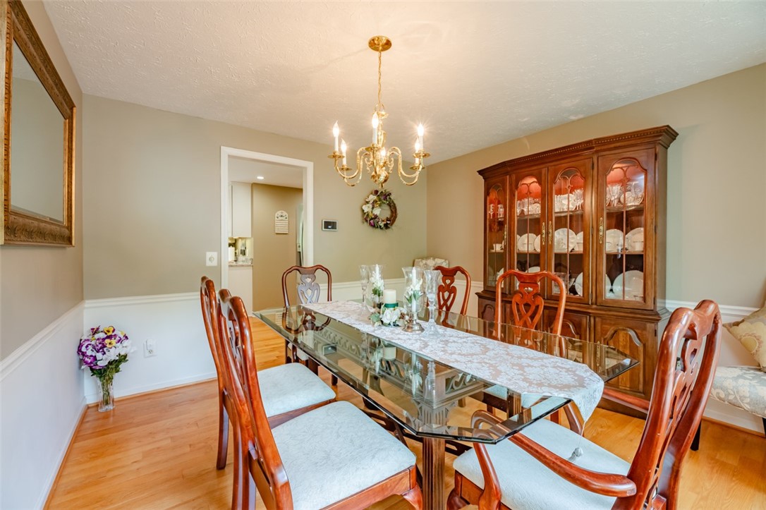 77 Misty Pine Road Perinton, NY 14450 - Photo 7 of 47 THE ELEGANT DINING ROOM IS SPACIOUS AND HAS GLEAMI